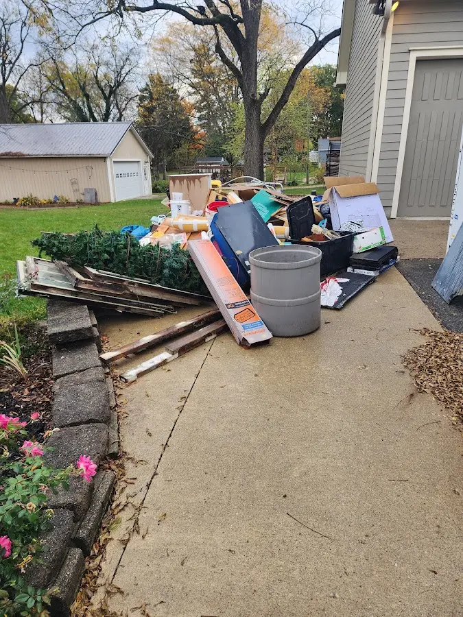 Dumpster being loaded with debris for 30 Yard Dumpster Rental in Oak Grove
